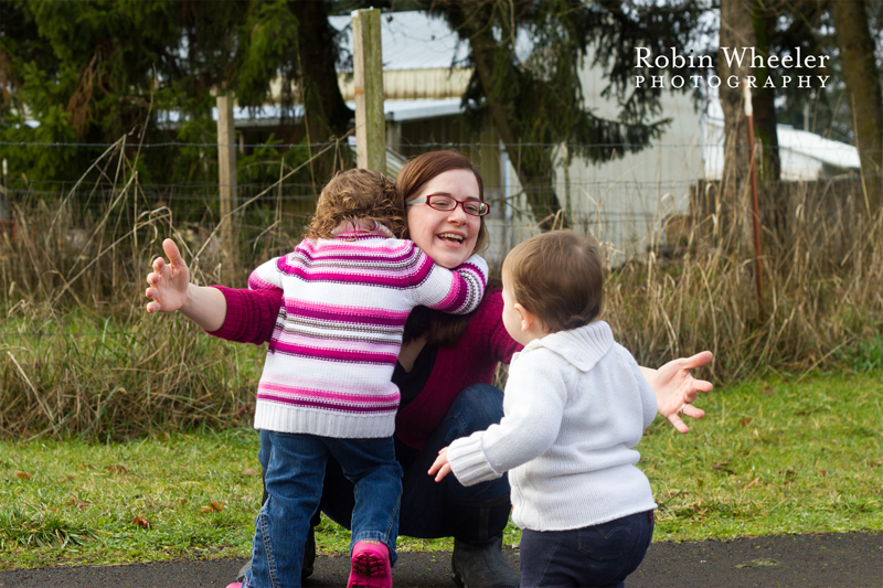 Mother embracing her two young children, Dallas, Oregon