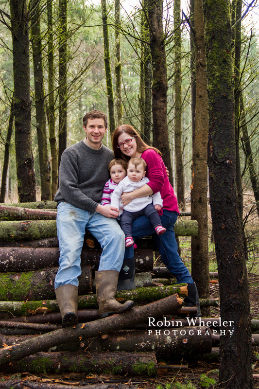 Family photo on a wood pile, Dallas, Oregon