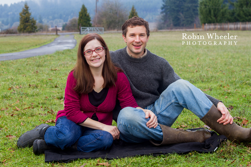 Couple sitting close together in a pasture, Dallas, Oregon