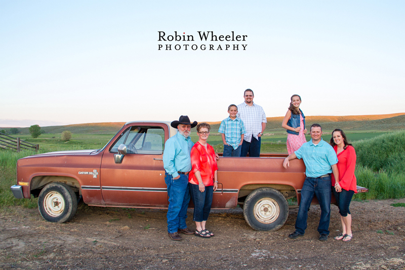 Photo of a family with an old orange pickup, Payette, Idaho