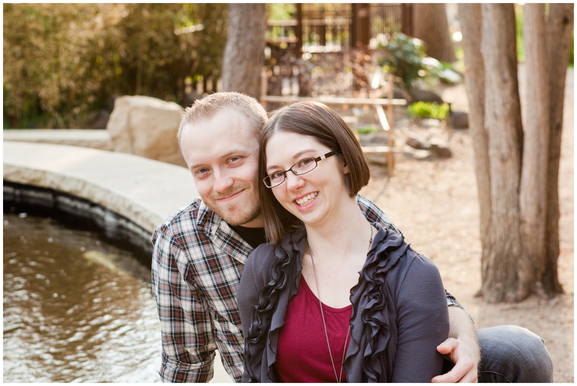 A couple sitting by the koi pond at the Idaho Botanical Gardens