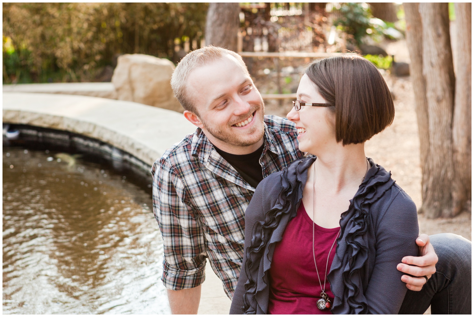 A couple sitting by the koi pond at the Idaho Botanical Gardens