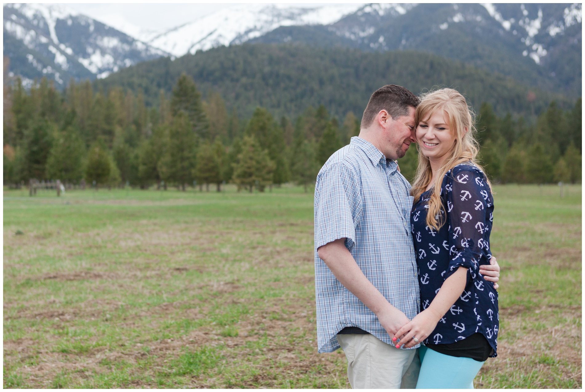 Engagement photos with Baker City, Oregon's snow-capped mountains in the background.