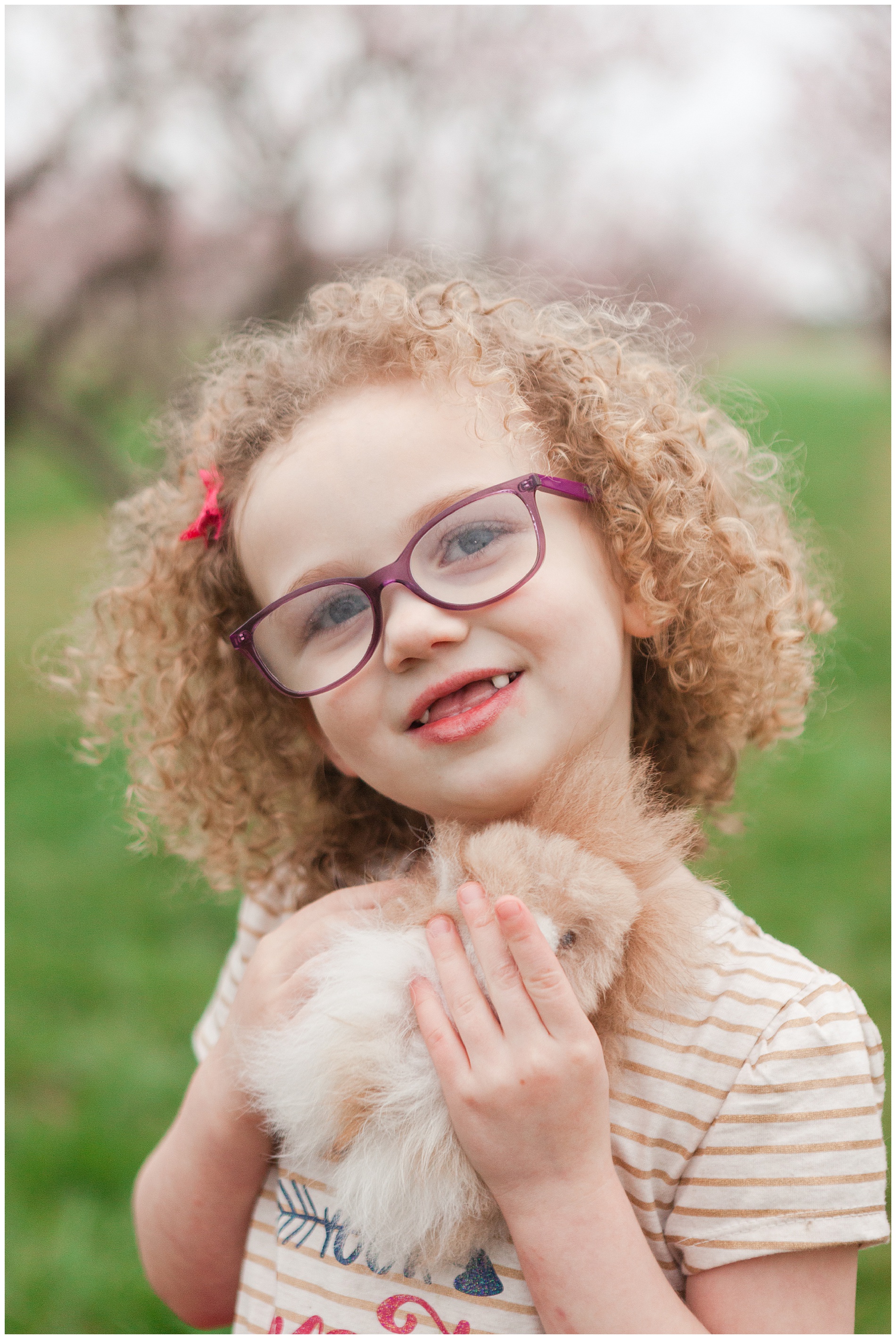 Fun and relaxed family portraits in a peach orchard with pink blossoms | Idaho family photographer | Robin Wheeler Photography