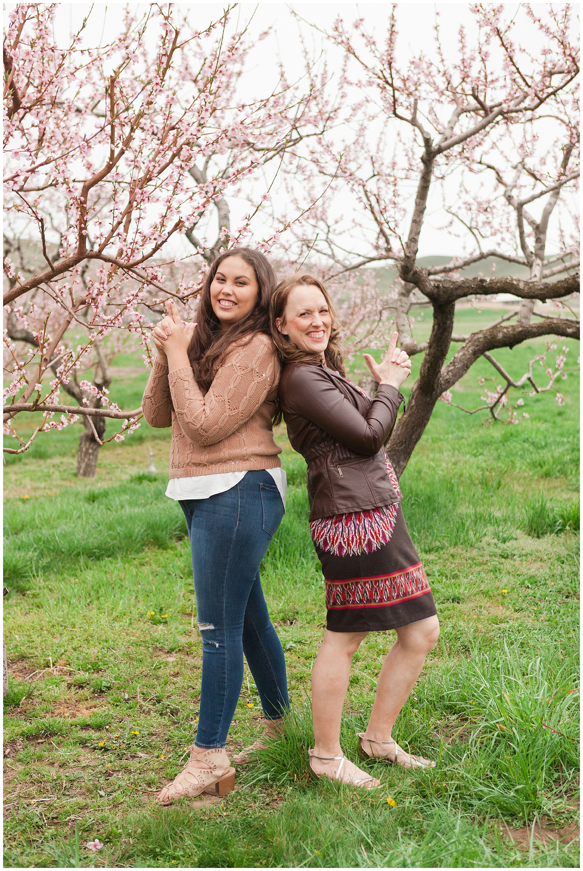 Fun and relaxed family portraits in a peach orchard with pink blossoms | Idaho family photographer | Robin Wheeler Photography