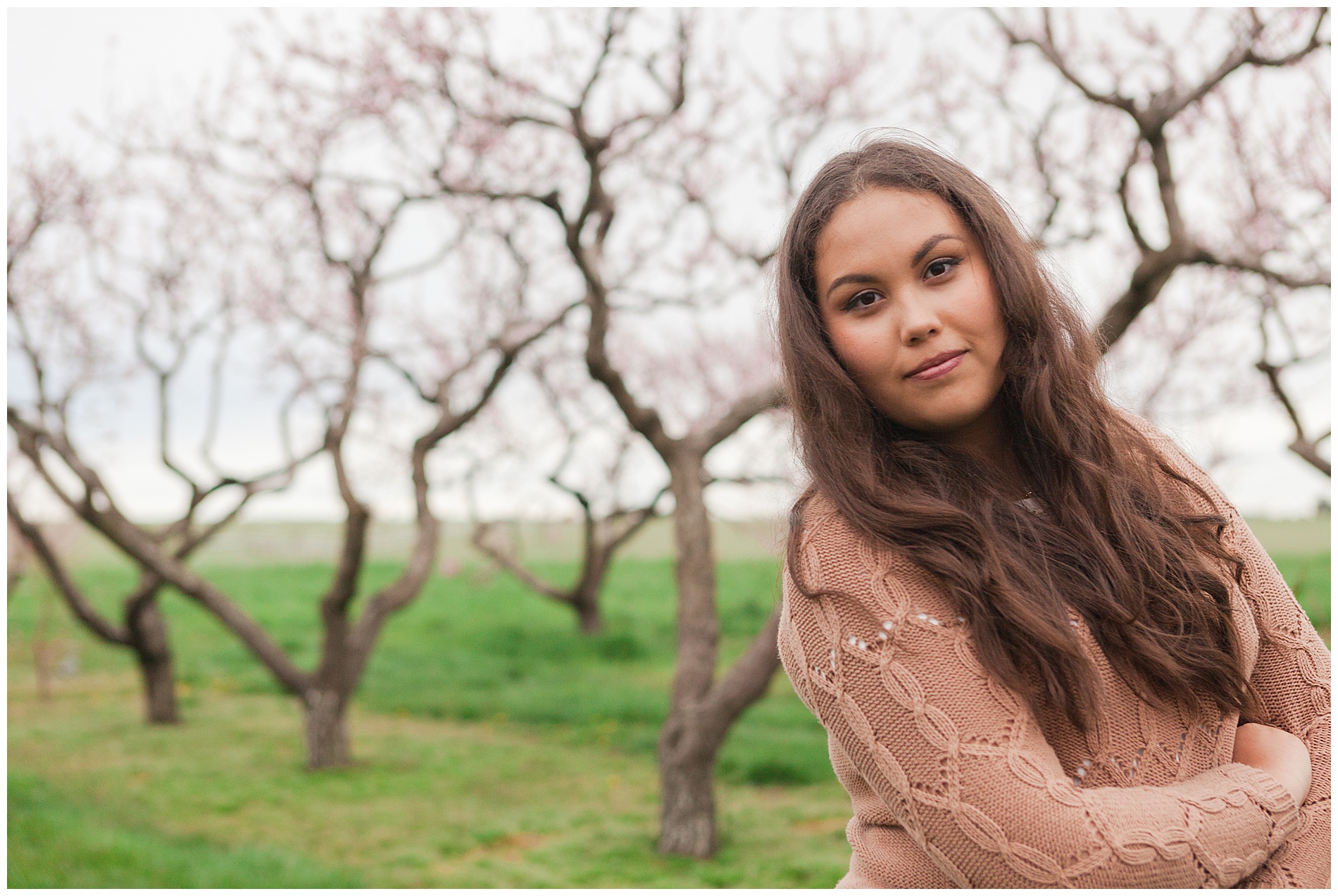 Fun and relaxed family portraits in a peach orchard with pink blossoms | Idaho family photographer | Robin Wheeler Photography