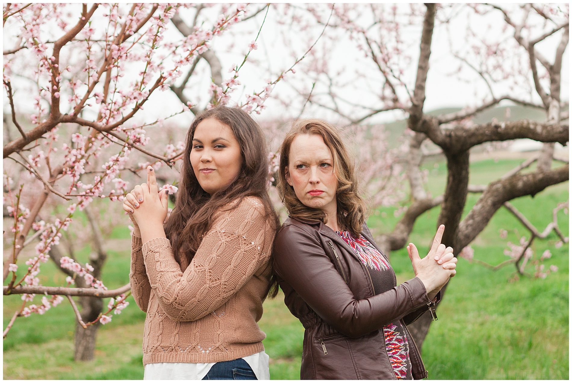 Fun and relaxed family portraits in a peach orchard with pink blossoms | Idaho family photographer | Robin Wheeler Photography