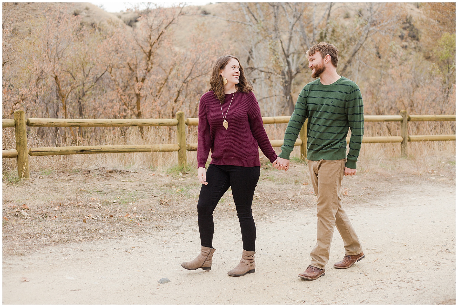 Fall engagement photos with a wooden fence in Boise's Military Reserve | Robin Wheeler Photography