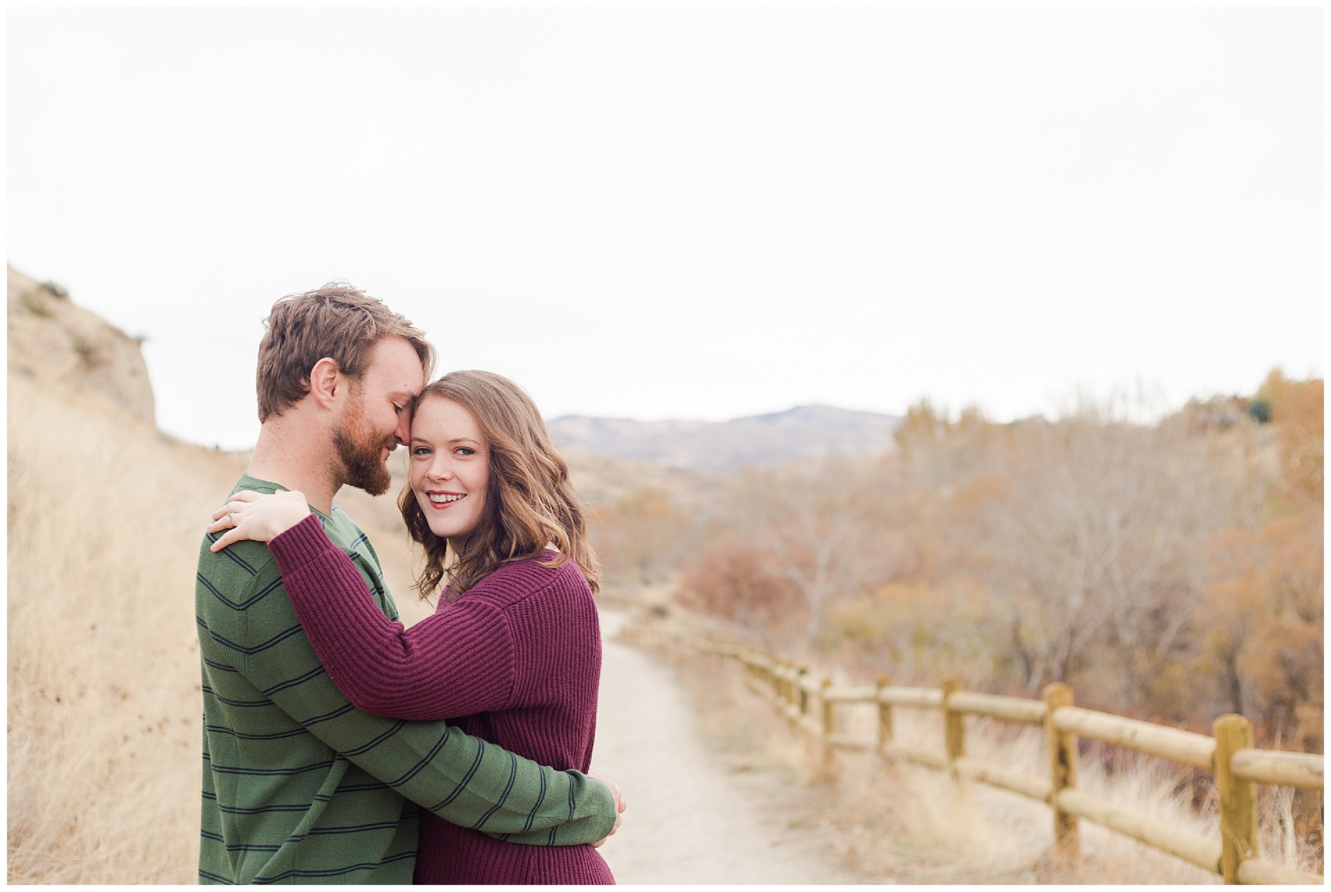 Fall engagement photos with a wooden fence in Boise's Military Reserve | Robin Wheeler Photography