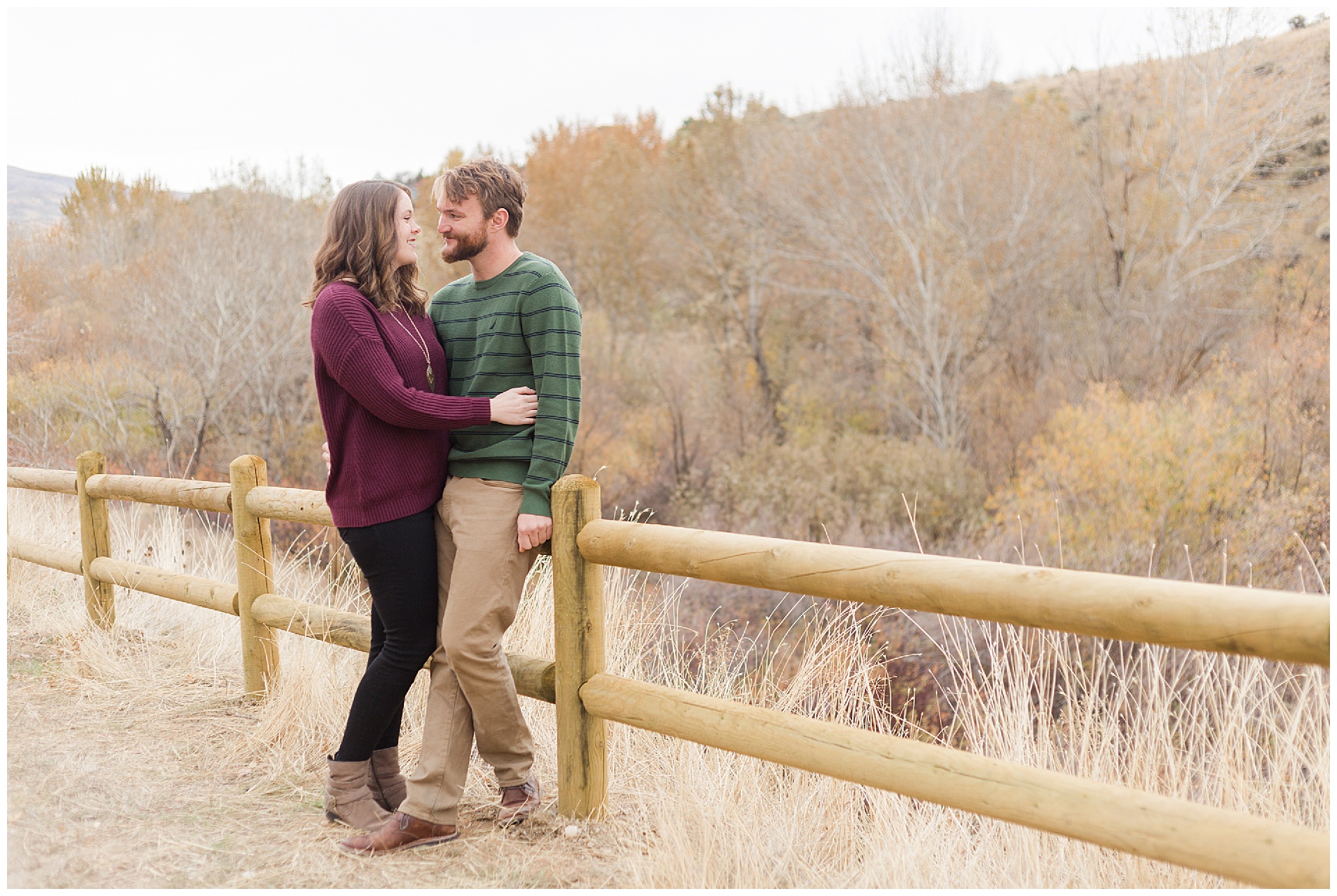 Fall engagement photos with a wooden fence in Boise's Military Reserve | Robin Wheeler Photography