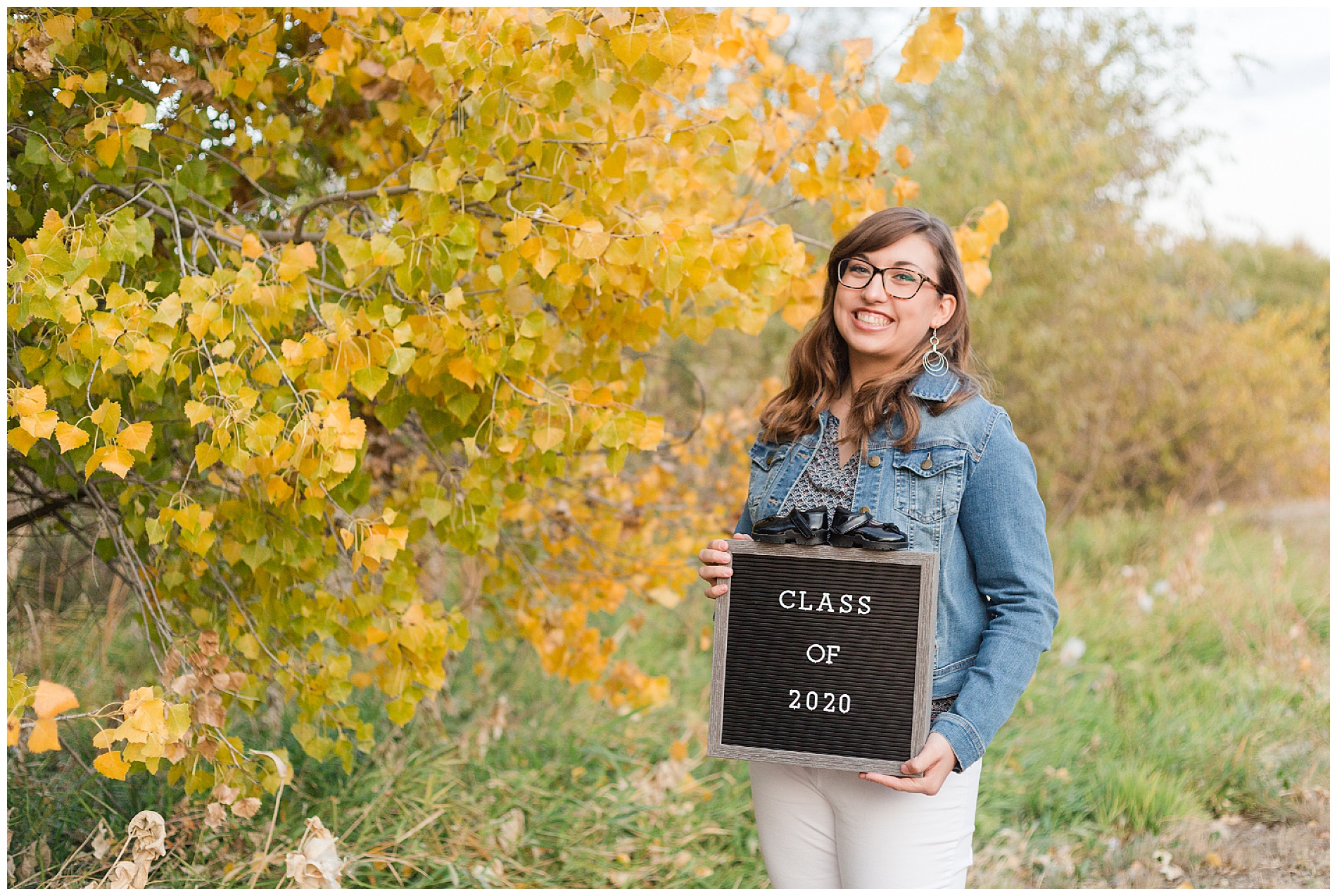 Senior photos with a letter board and baby shoes | Robin Wheeler Photography