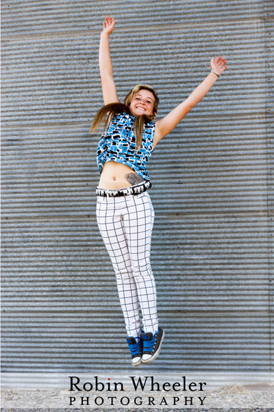 senior portrait of a girl jumping in downtown ontario, oregon