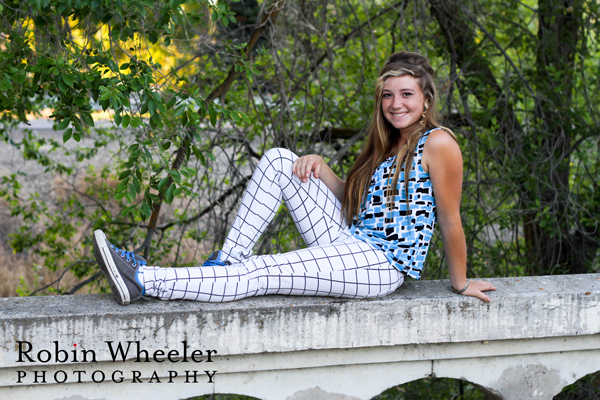 senior portrait of a girl on a stone bridge in ontario, oregon