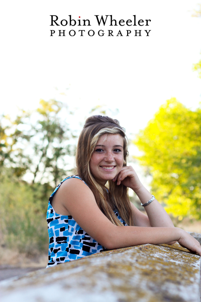 senior portrait of a girl on a stone bridge in ontario, oregon