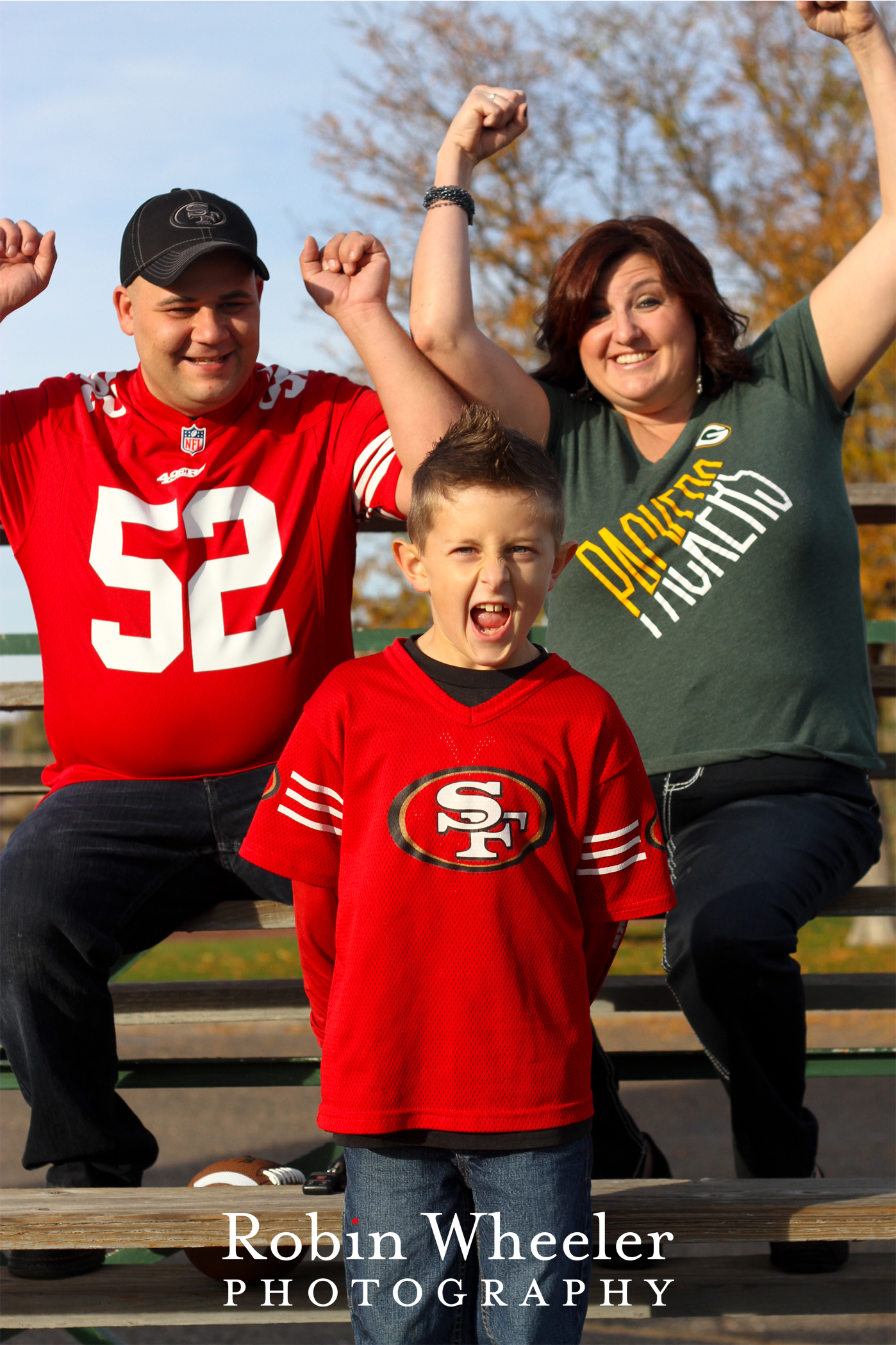 family cheering for favorite football teams