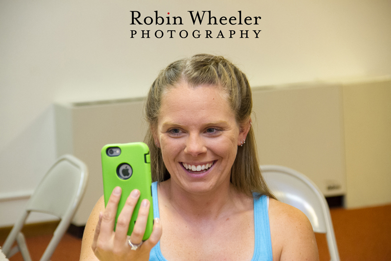 Bride smiling as she Skypes with a friend before her wedding, Ontario, Oregon