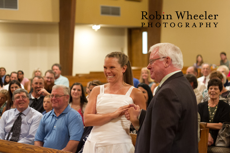 Bride smiling at groom during wedding ceremony, Ontario, Oregon