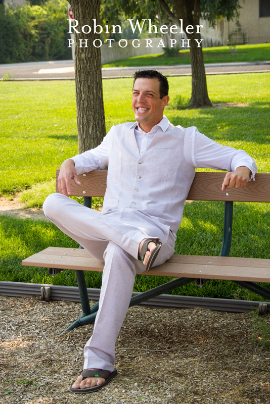 Portrait of groom sitting on a bench, Ontario, Oregon