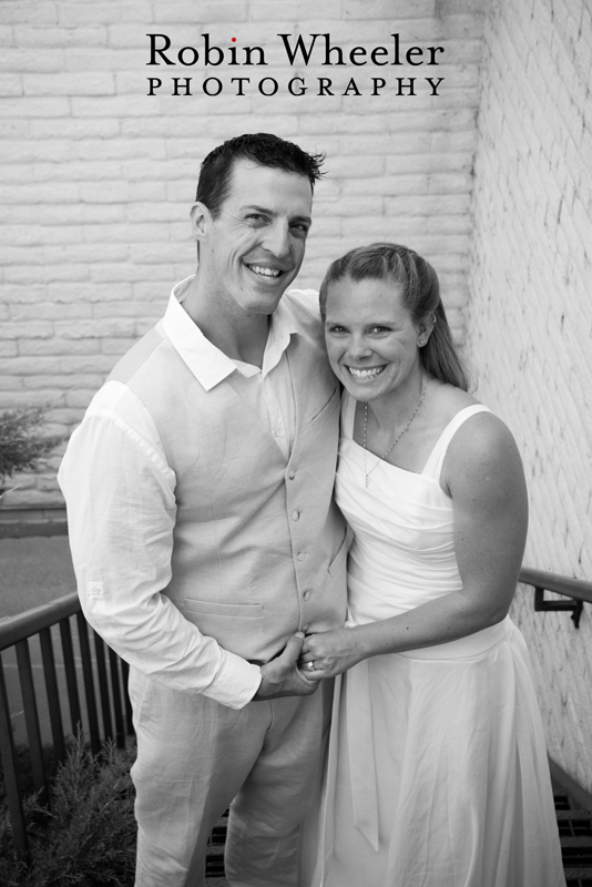 Black and white traditional style portrait of groom and bride standing on stairs, Ontario, Oregon