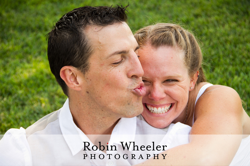 Groom pretending to kiss bride, who is laughing, Ontario, Oregon