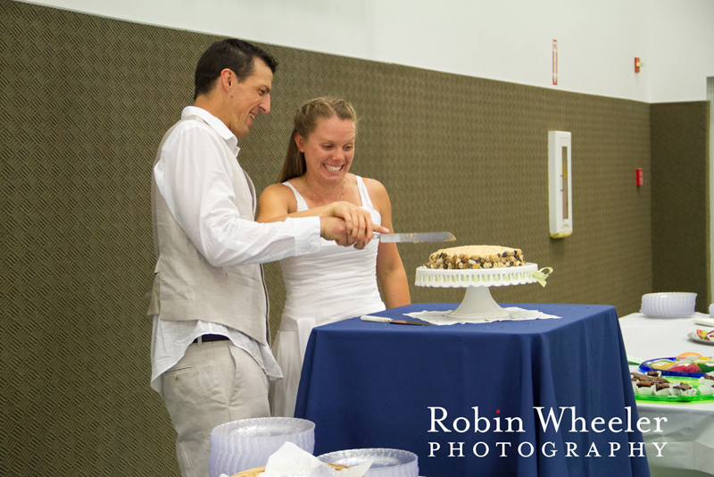 Groom and bride cutting their wedding cake during the reception, Ontario, Oregon