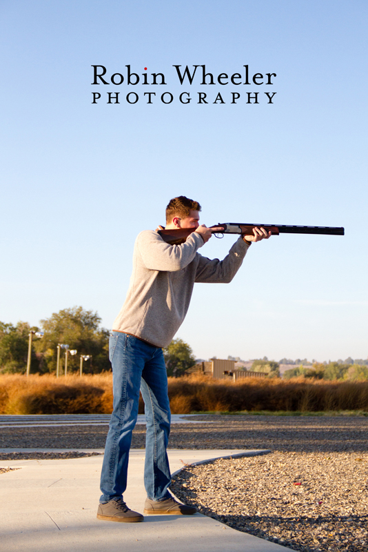 Senior photo of a boy with a shotgun, Ontario, Oregon