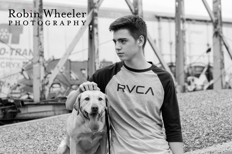 Black and white portrait of a high school senior boy with his dog in Ontario, Oregon