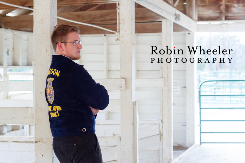 Photo of a high school senior in a barn at the Malheur County Fairgrounds in Ontario, Oregon