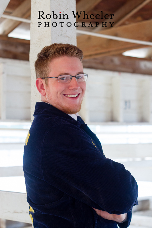 Photo of a high school senior in a barn at the Malheur County Fairgrounds in Ontario, Oregon