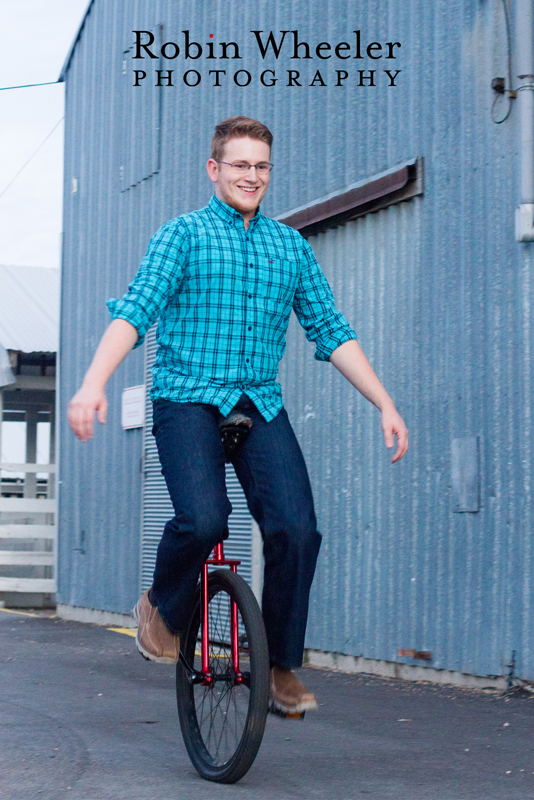 Photo of a high school senior riding a unicycle at the Malheur County Fairgrounds in Ontario, Oregon