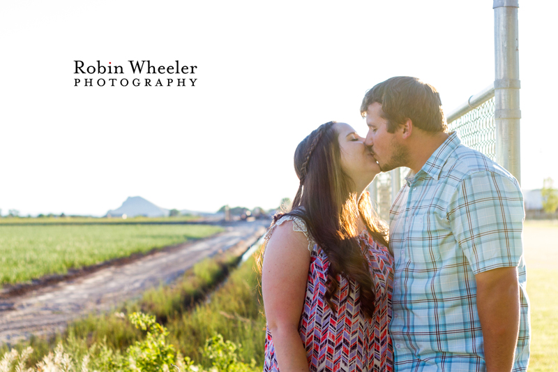 Couple kissing with Malheur Butte in the background