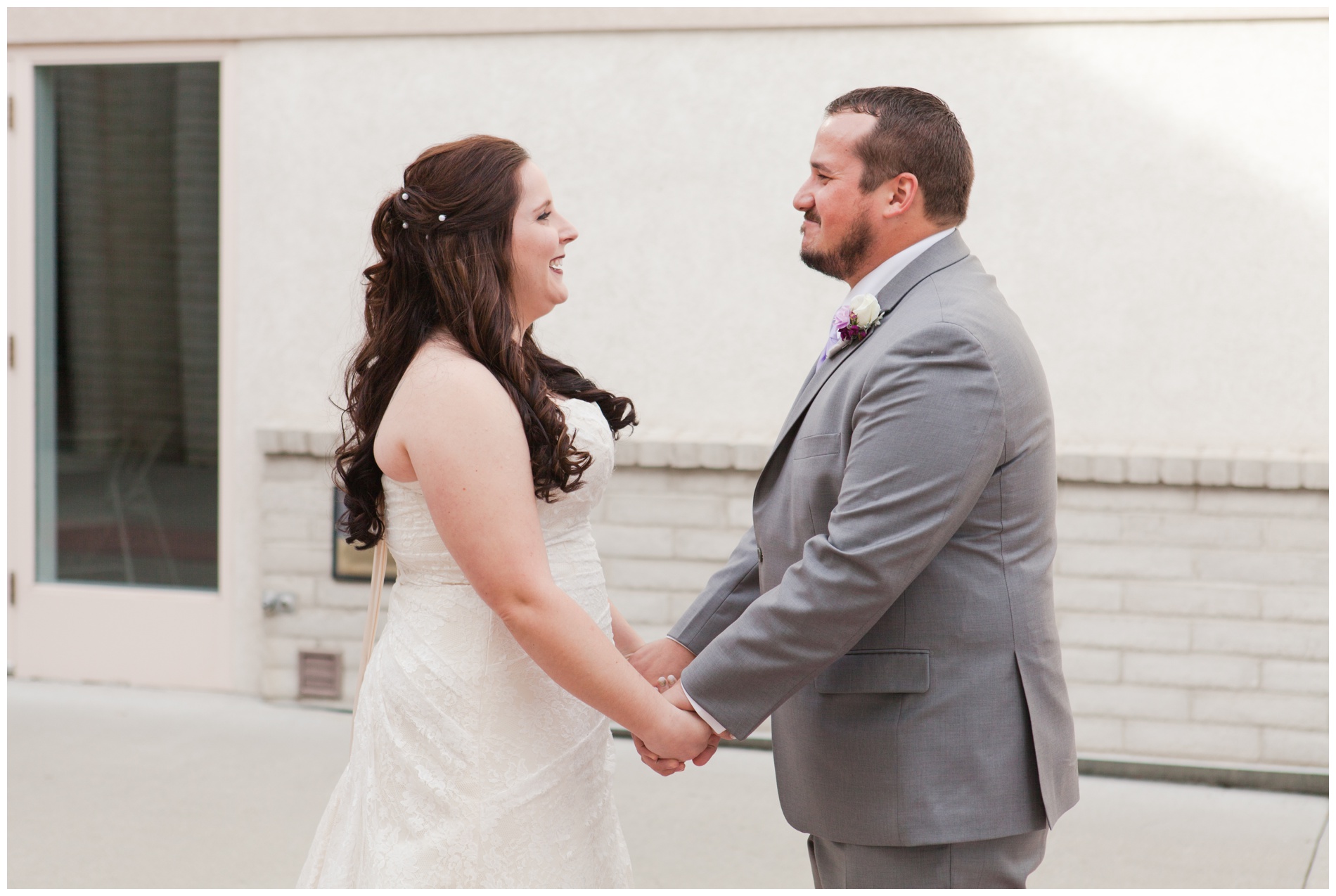 The bride and groom see each other for the first time on their wedding day