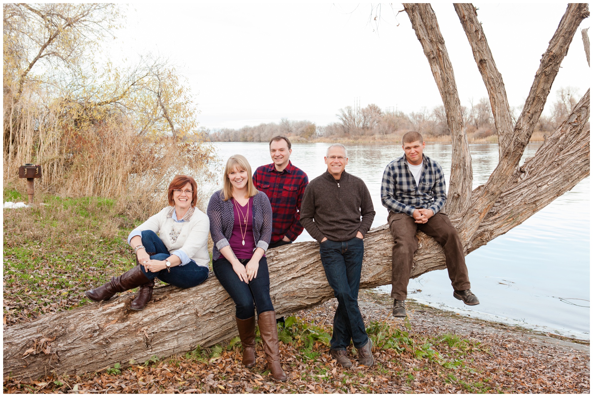 Fall family on a fallen tree at Ontario State Park