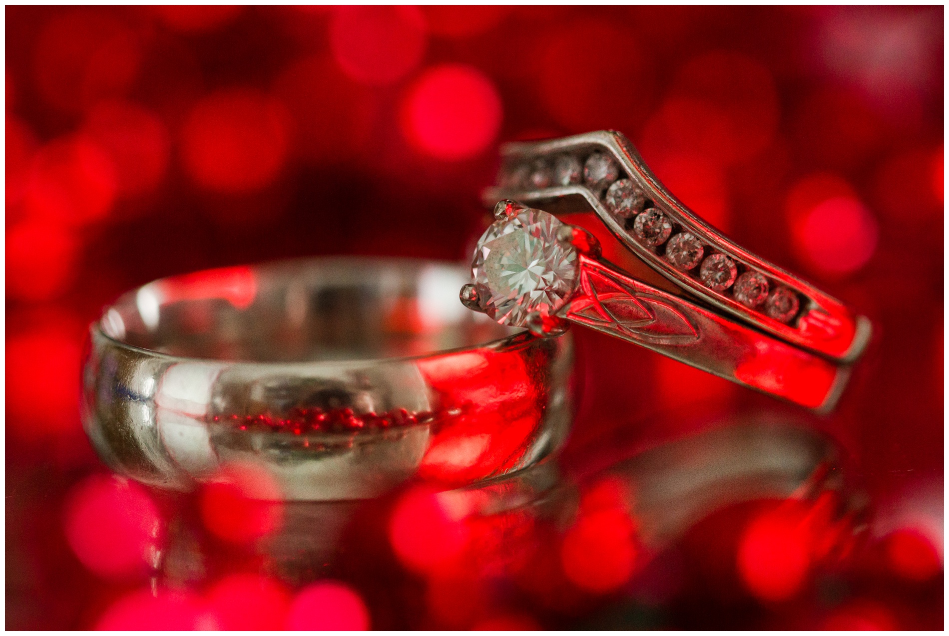 Wedding rings and red bokeh