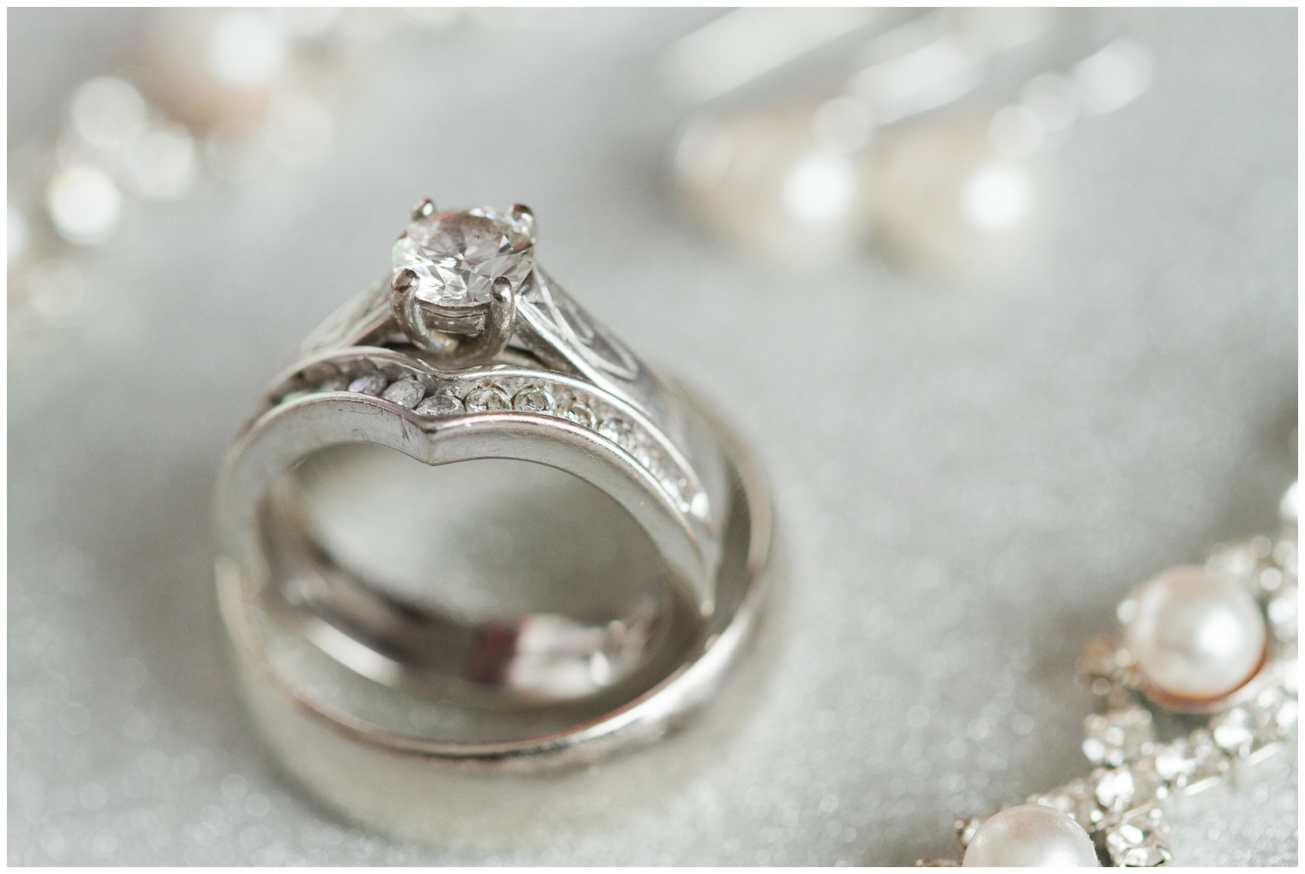 Wedding rings with other jewelry blurred out in the background