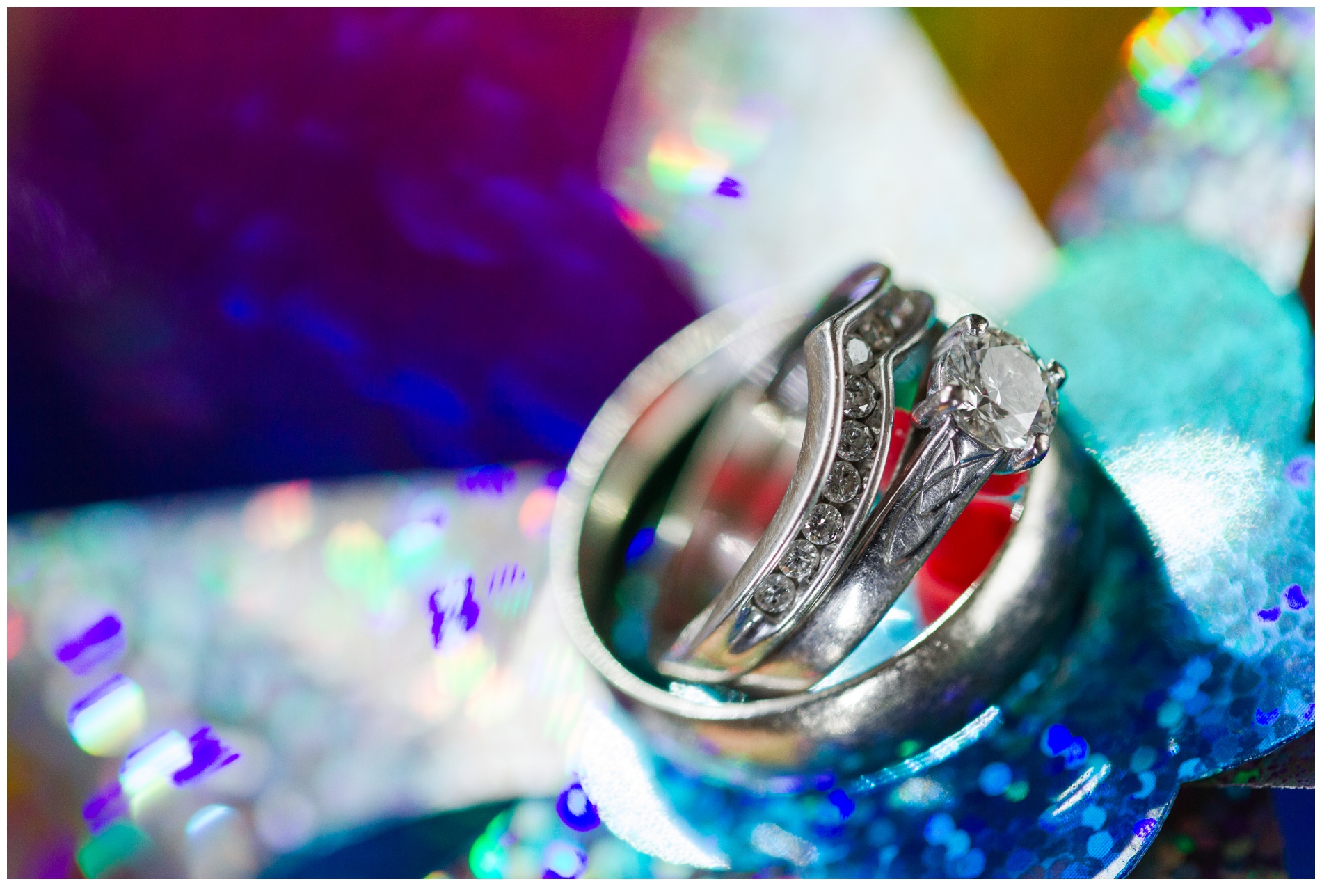 Wedding rings on a rainbow-colored pinwheel