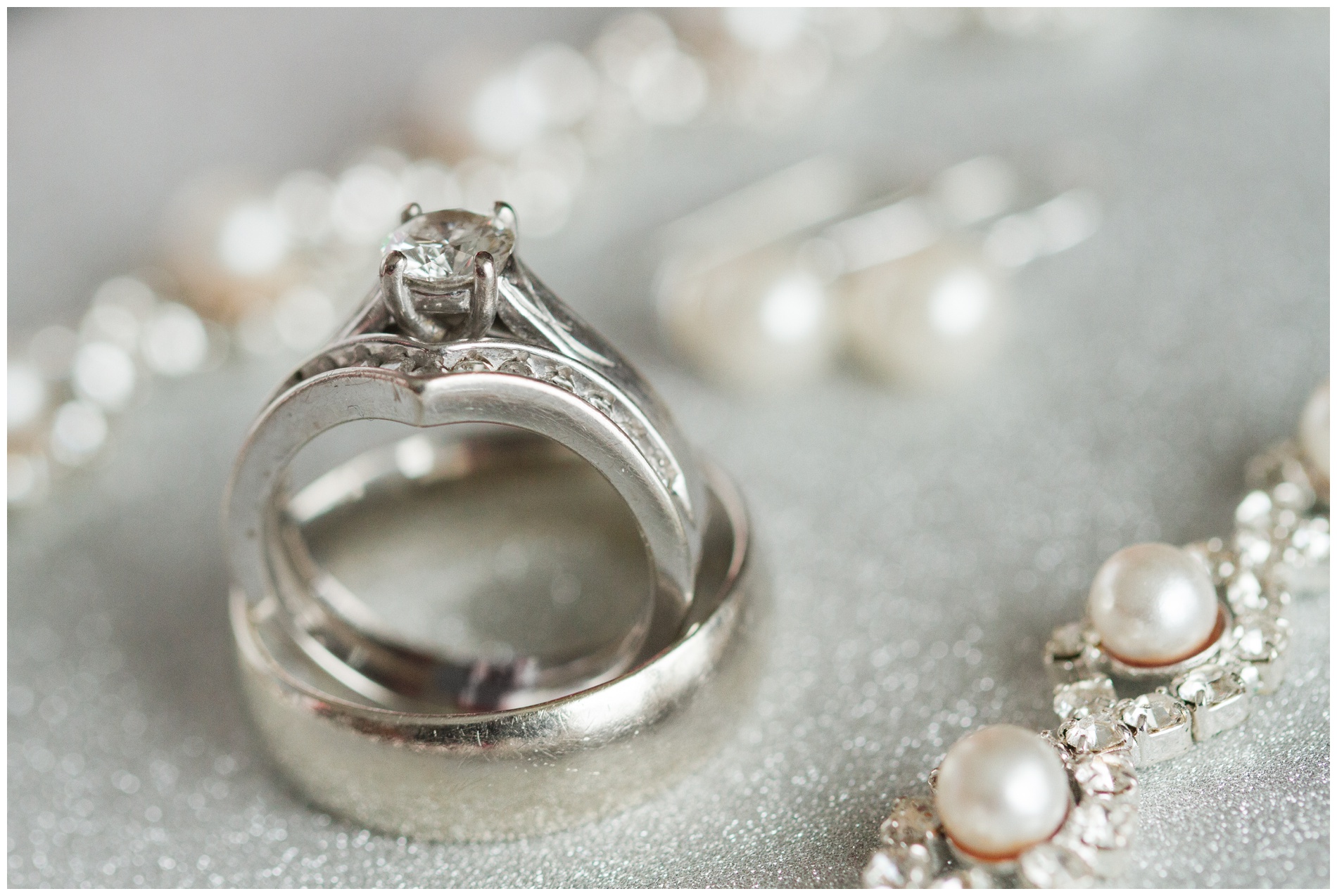 Wedding jewelry on a white sparkly backdrop