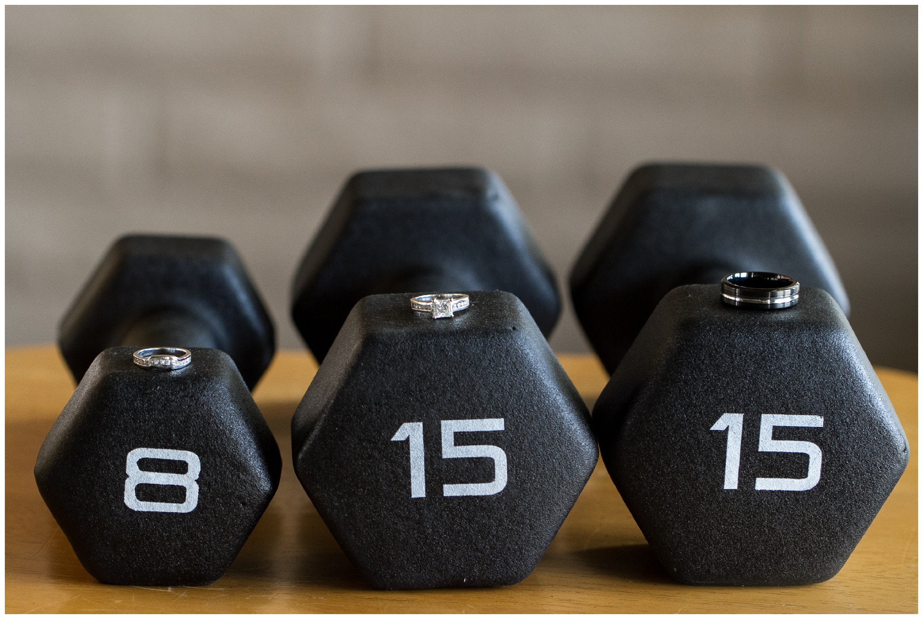 Rings on barbells, the weights spelling out the wedding date: August 8, 2015