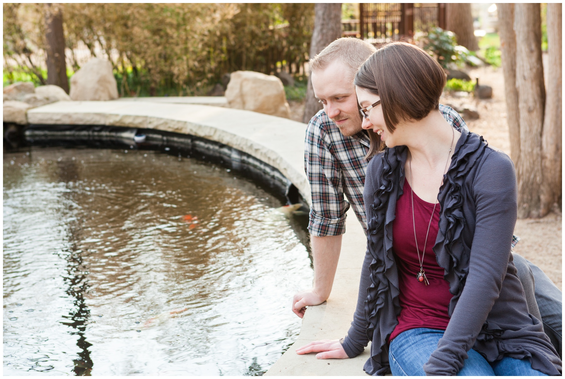 A couple sitting by the koi pond at the Idaho Botanical Gardens