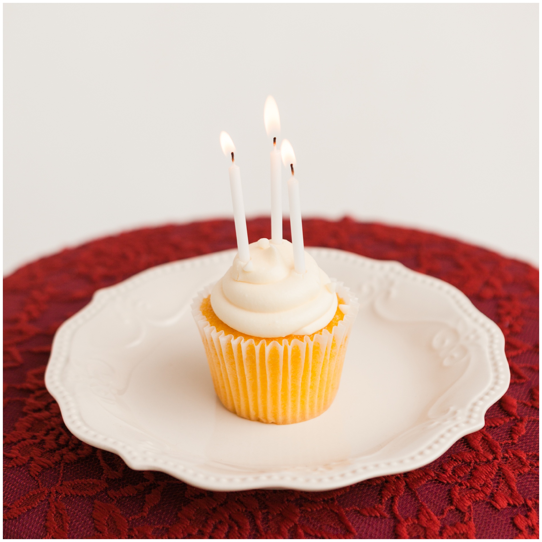 Cupcake with three candles, celebrating three years of Robin Wheeler Photography in Ontario!
