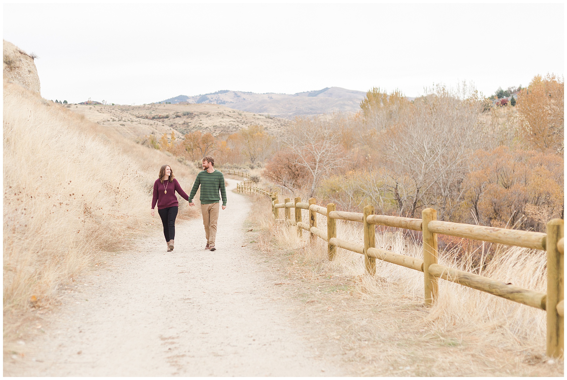 Fall engagement photos with a wooden fence in Boise's Military Reserve | Robin Wheeler Photography