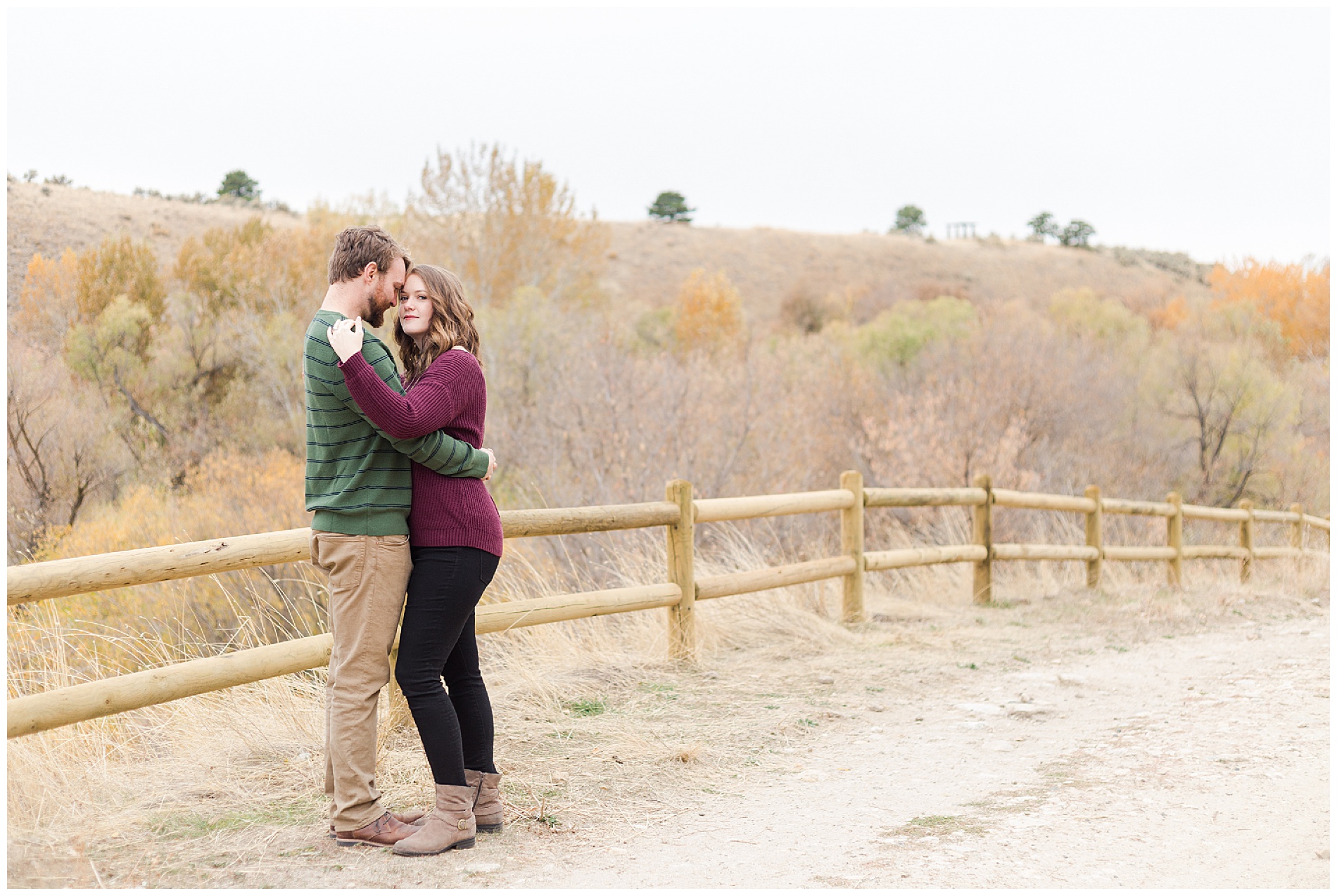 Fall engagement photos with a wooden fence in Boise's Military Reserve | Robin Wheeler Photography