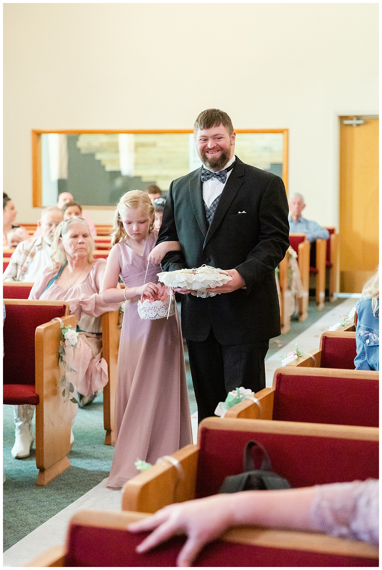 Flower girl and ring bearer walk down the aisle