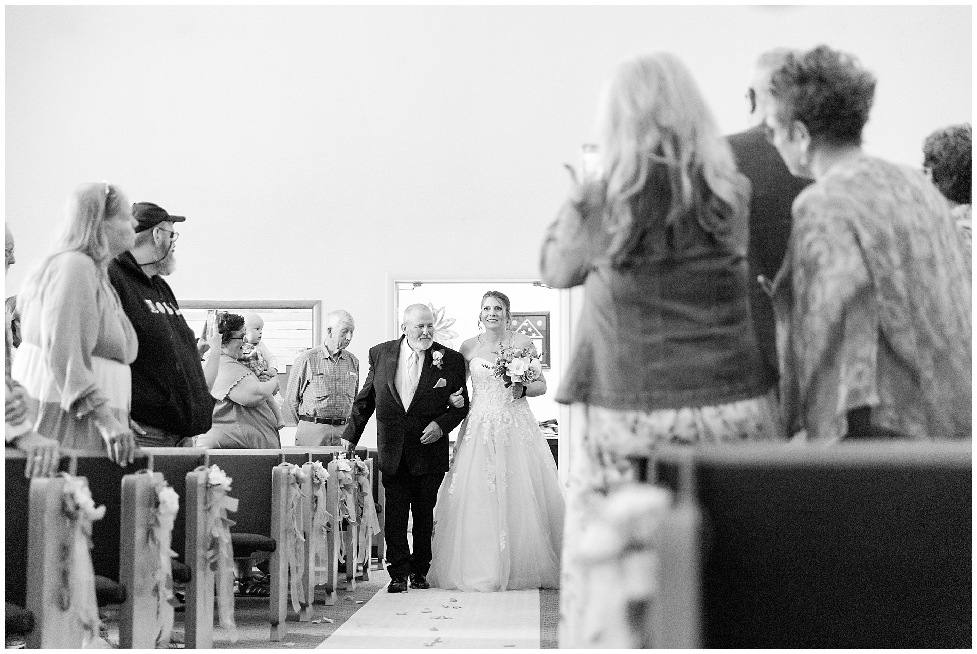 The bride and her father enter the sanctuary