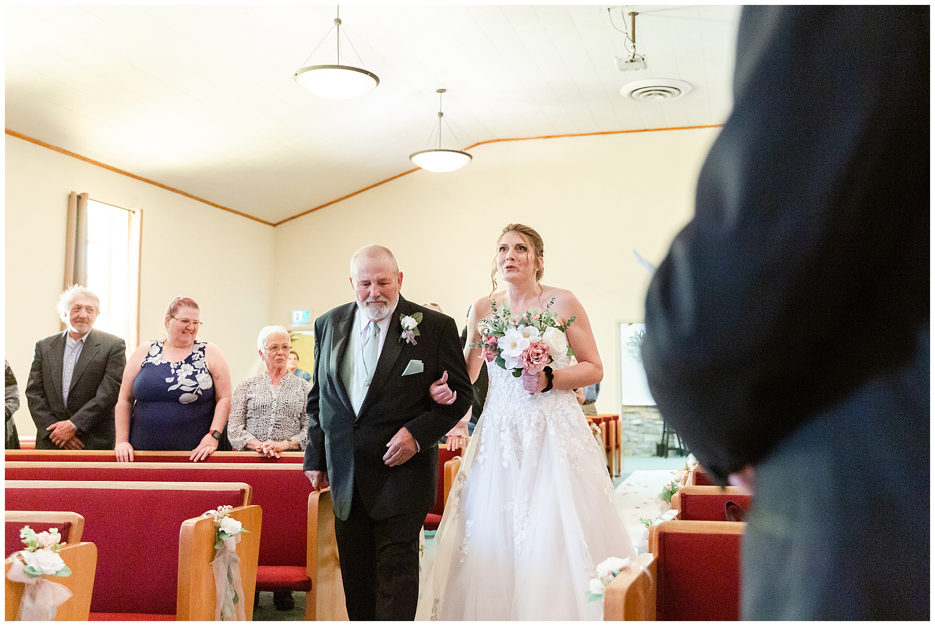 Amanda sings as she walks down the aisle with her father