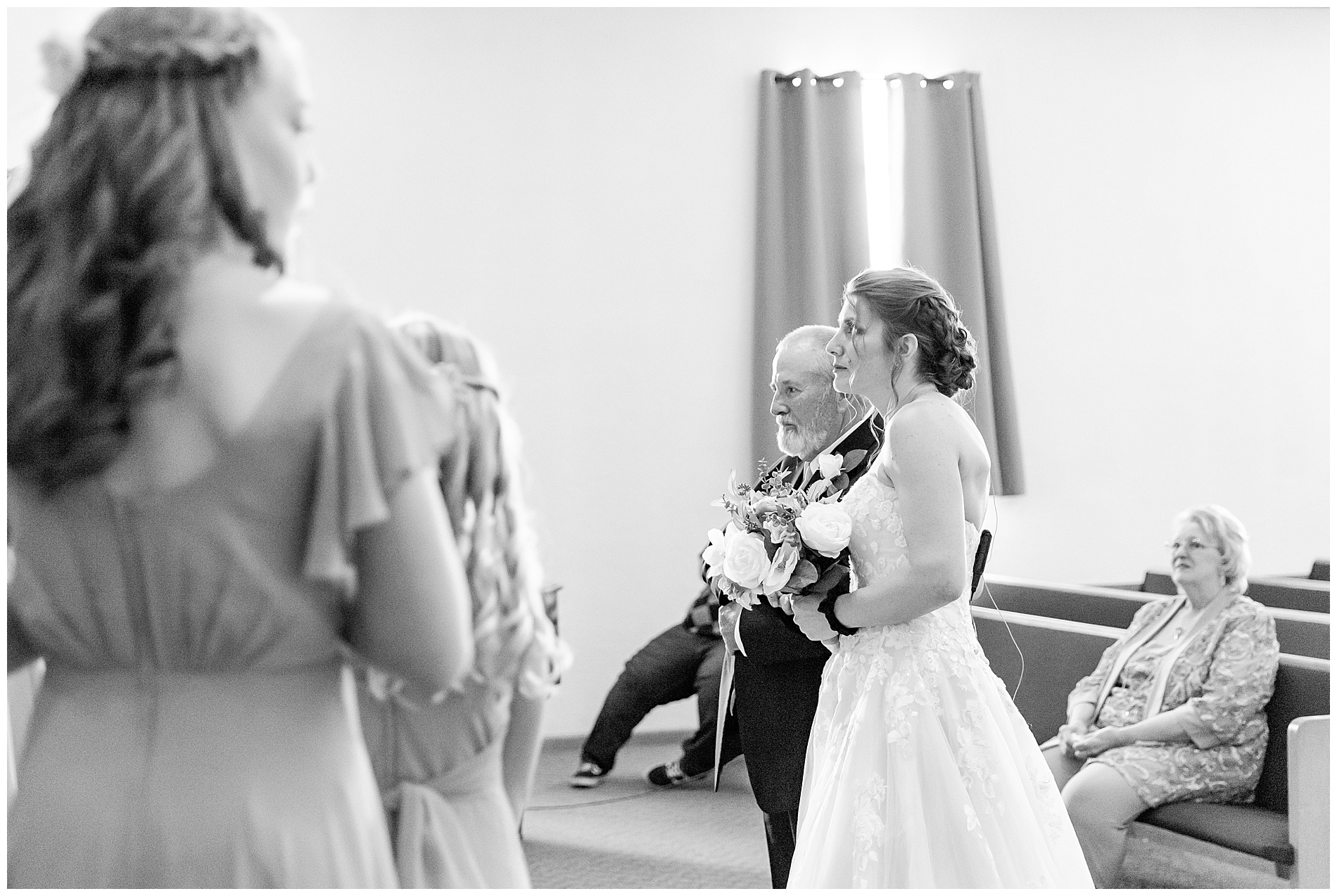 The bride and her father at the top of the aisle