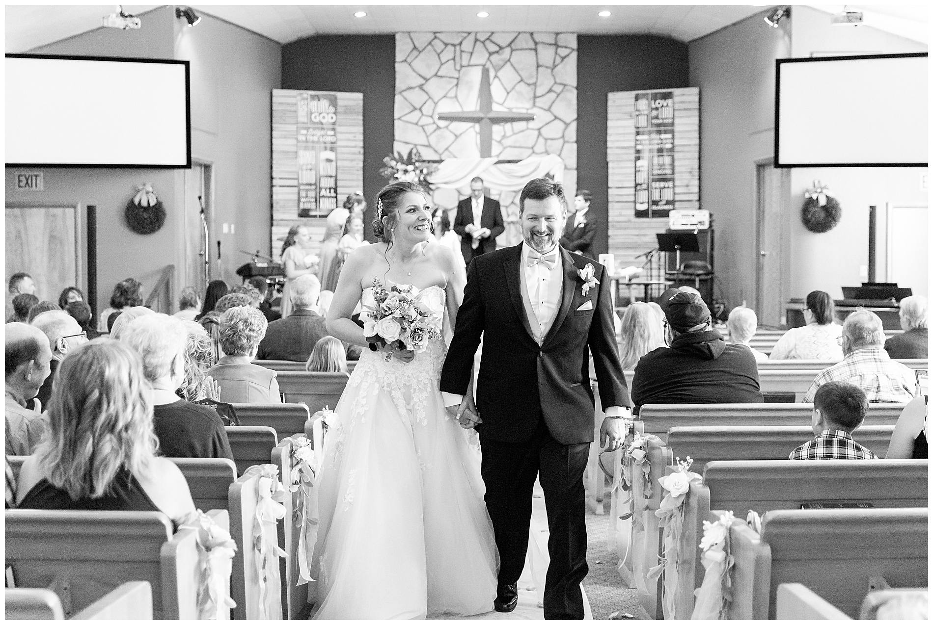 Amanda and Derrick walking back down the aisle together