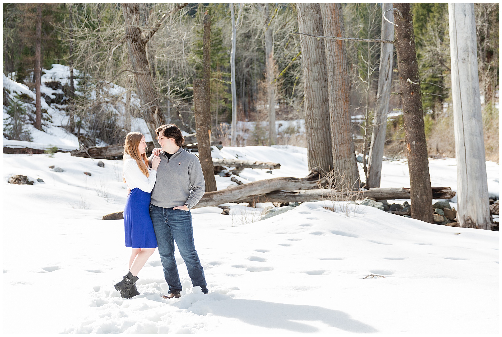 Engaged couple in the snow near Wallowa Lake