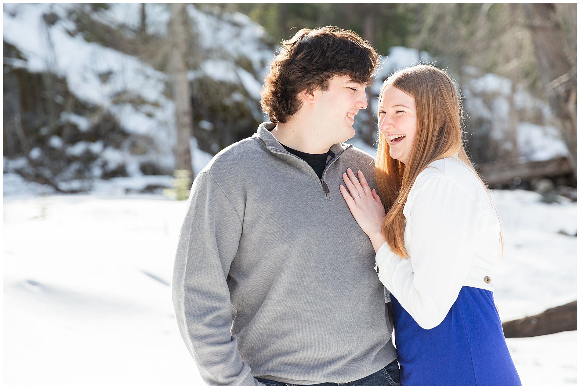 Couple laughing during engagement photo session