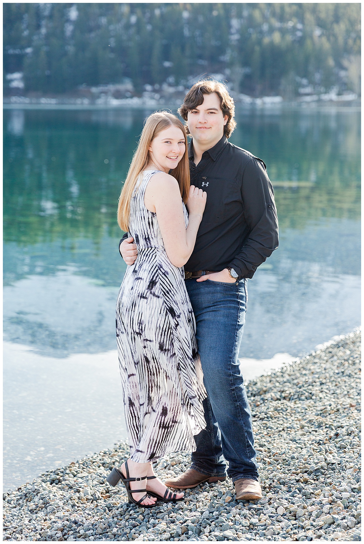 Engaged couple on the shore at Wallowa Lake Park